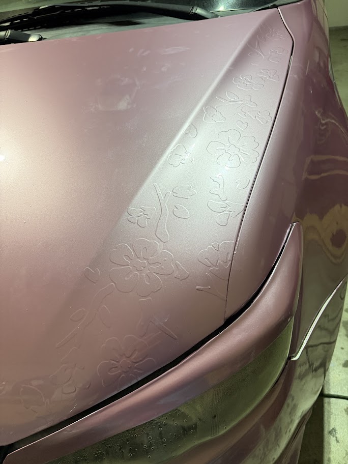 PETTY TC embossed floral hood detail